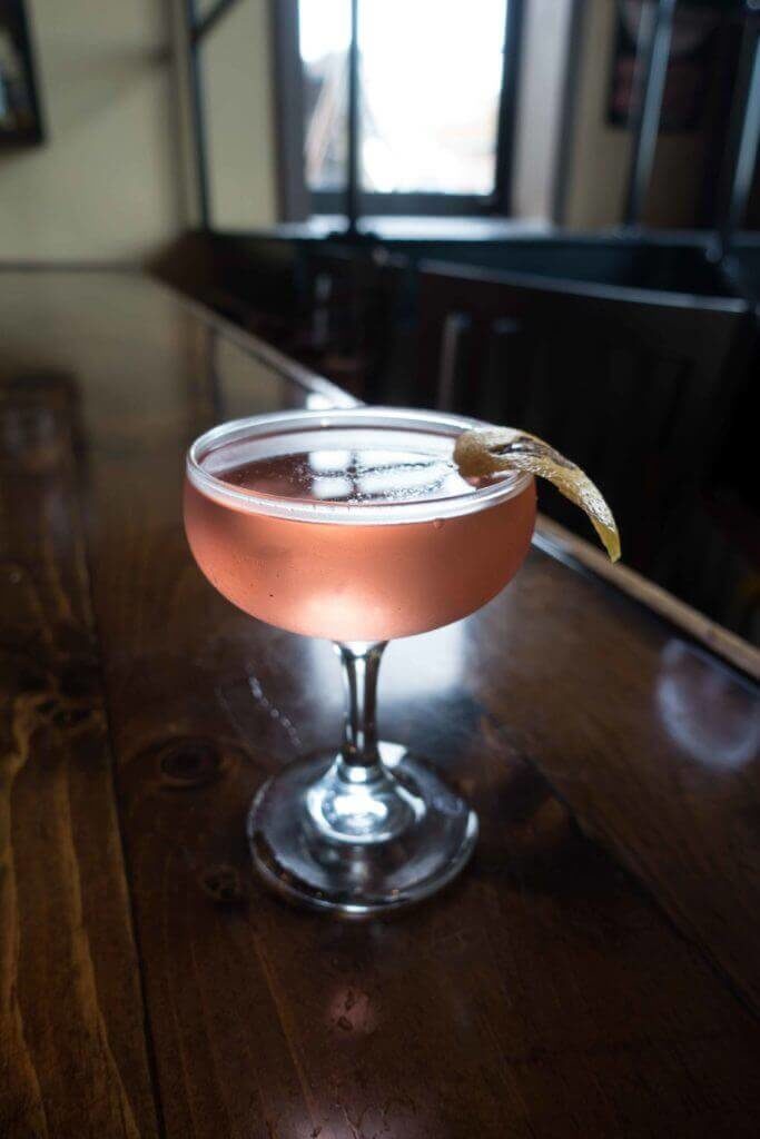 Aviation Cocktail at Blue Duck in St Louis - Drink with Lemon Peel - Backlight