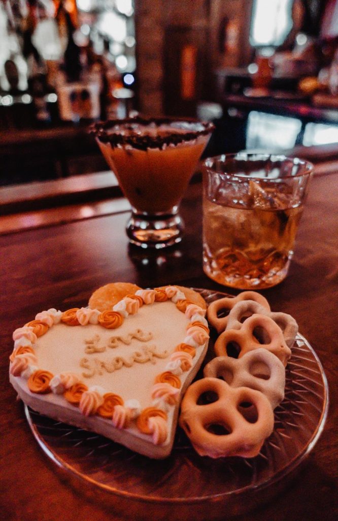 The Chocolate Covered strawberry martini, a Love Shack old fashioned, and a plate of delicious cookies. 