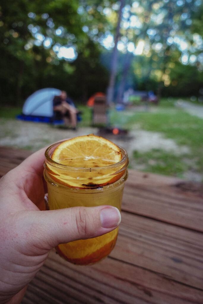 Drinking a campfire cocktail - tent camping for beginners