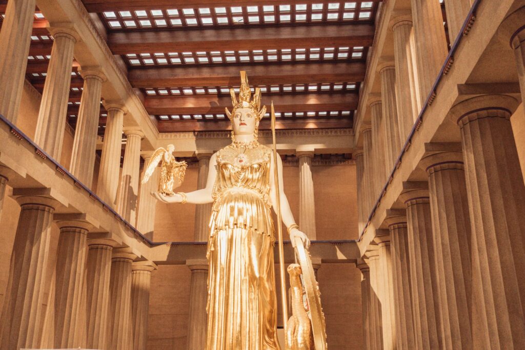 A large gold Athena Statue inside the Parthenon in Nashville Tennessee.  A must see stop on our Nashville weekend Itinerary